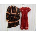 1950's child's red velvet dress with white rick-rack trimming and belt and a printed child's