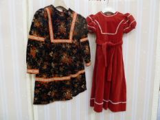 1950's child's red velvet dress with white rick-rack trimming and belt and a printed child's