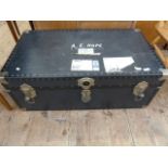 Large vintage travelling trunk with British Parcel Service label, containing a quantity of