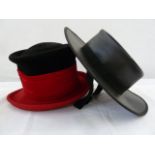 Philip Treacy black and red wool chimney pot-style felt hat and a Spanish leather riding hat