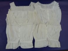 Lace mob cap, a white broderie anglaise little bodice and assorted Victorian/Edwardian bodices,