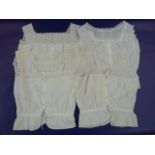 Lace mob cap, a white broderie anglaise little bodice and assorted Victorian/Edwardian bodices,