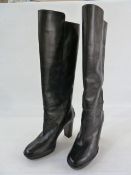 Pair of black leather Todd knee-high boots with stack heels, pimple rubber soles, barely worn,