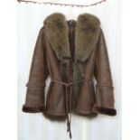 Brown shearling jacket, suede outer, fox collar, suede tie belt, suede tassel detail to sleeves,