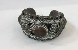 West African(?) bronze cuff bracelet, pierced decoration with circle and lozenge relief