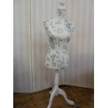 Modern white painted wooden based dress maker's dummy with black and white patterned fabric body