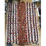 Large multi-coloured cotton kelim-style rug with hand knotted loose threads and fringes at two ends,