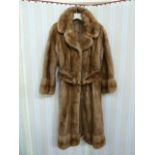 1970's full-length mink coat with banded hem, cuff sleeves, with belt and metal buckle