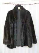 Three-quarter length black Ranch mink jacket with bell sleeves Condition ReportNo Labelling; the