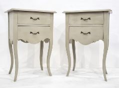 Pair of modern bedside tables with shaped tops and moulded edges, above two drawers, on cabriole