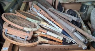 Various vintage skates, ladies and mens', a collection of vintage hockey sticks and wooden tennis