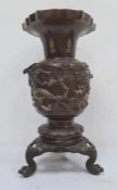 Japanese bronze and gilded vase with shouldered ovoid body, flared rim and circular foot, embossed