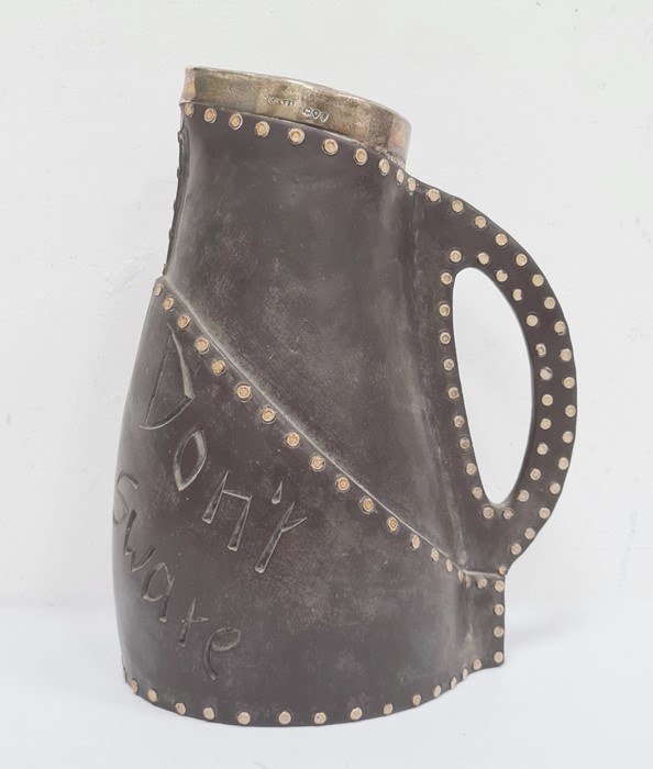 Doulton silver-mounted jug, leather studded-effect, marked 'Drinke Faire Dont Sware'', with silver