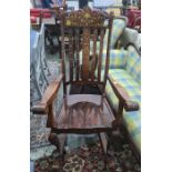 Eastern hardwood rocking chair intricately decorated with brass inlay