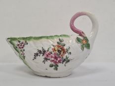 Chelsea porcelain sauce boat, leaf moulded and with curled twig-pattern handle, allover painted with