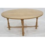 Modern oak oval coffee table on turned supports, stretchered base, 98cm wide