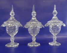 Set of three 19th century cut glass sweetmeat jars with covers, pointed finials , waisted stem on