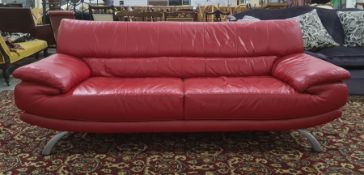 Modern red leather three piece suite to include three seater sofa, armchair and chaise longue