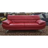 Modern red leather three piece suite to include three seater sofa, armchair and chaise longue