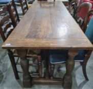 Late 19th/early 20th century oak table, the rectangular top with pleated end supports, turned and