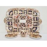 Pair of Davenport cups and saucers, matching milk jug and rectangular tray in the Imari palette