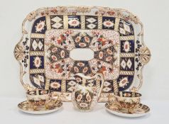 Pair of Davenport cups and saucers, matching milk jug and rectangular tray in the Imari palette