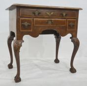 20th century walnut lowboy, the rectangular top with canted front corners, moulded edge and