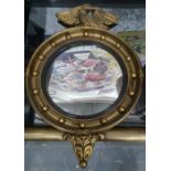 Modern circular wall mirror surmounted by eagle, moulded frame