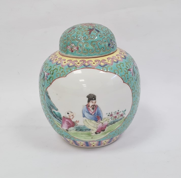 Chinese ginger jar and cover with painted panels depicting a man and boy and a lady with fan,