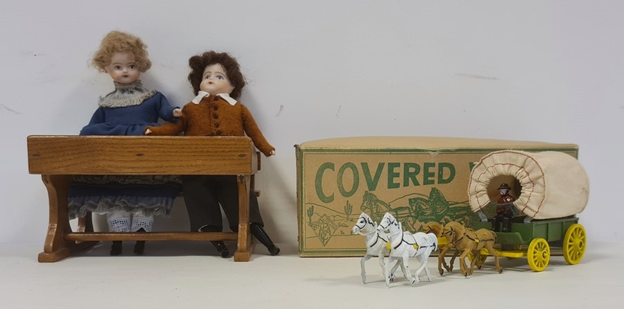 Two porcelain headed dolls in Victorian-style dress, seated at a wooden school desk and 'A Modern - Image 2 of 2