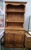 20th century dresser with assorted shelves and four short drawers, on base of two drawers and two