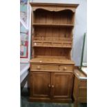 20th century dresser with assorted shelves and four short drawers, on base of two drawers and two
