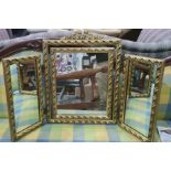 20th century three-part folding dressing table mirror, the gilt decorated frame surmounted by ribbon