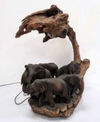 Statement table lamp constructed from driftwood and with a family of carved wooden elephants,