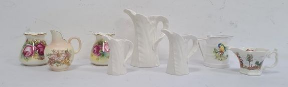 Set of three Royal Worcester ivory porcelain leaf moulded graduated jugs, pair Royal Worcester