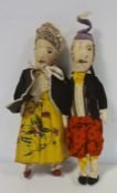 Pair of late 19th/early 20th century cloth Punch and Judy dolls, he with velvet jacket and she