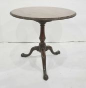 19th century tilt-top circular table with carved edge, on birdcage, to baluster turned supports