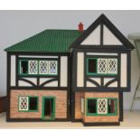 20th century doll's house in the Tudor style with various 20th century doll's house furniture and
