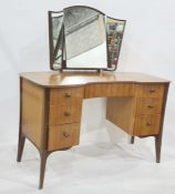 Heals of Tottenham Court Road, London dressing table with three-part mirror and shaped top, above