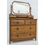 20th century oak dressing chest with mirrored superstructure, two drawers above two cupboard doors