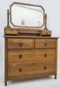 20th century oak dressing chest with mirrored superstructure, two drawers above two cupboard doors