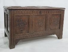 Antique oak coffer having framed panel top, nulled frieze, the triple frame panel front on carved