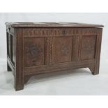 Antique oak coffer having framed panel top, nulled frieze, the triple frame panel front on carved