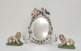 Late 19th century Sitzendorf porcelain oval mirror with candle sconces, decorated with a pair of