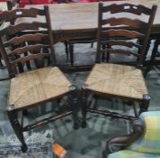 Set of four oak ladderback rush seated chairsCondition ReportMatching set, all rush seats in good
