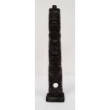 Haida-style carved argillite (probably) totem pole carved with three crouching figures, 42cm high (