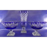 Pair of blue glass pedestal bowls of circular form with flash cut floral decoration, on stepped