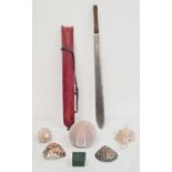 Steel sword with stained red hide sheath and various shells