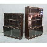 Two 20th century mahogany bookcases, each in the sectional style, with sliding glass doors (2)