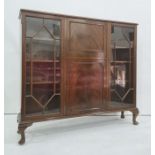 20th century mahogany lounge unit, the rectangular top above moulded edge, central fall and cupboard